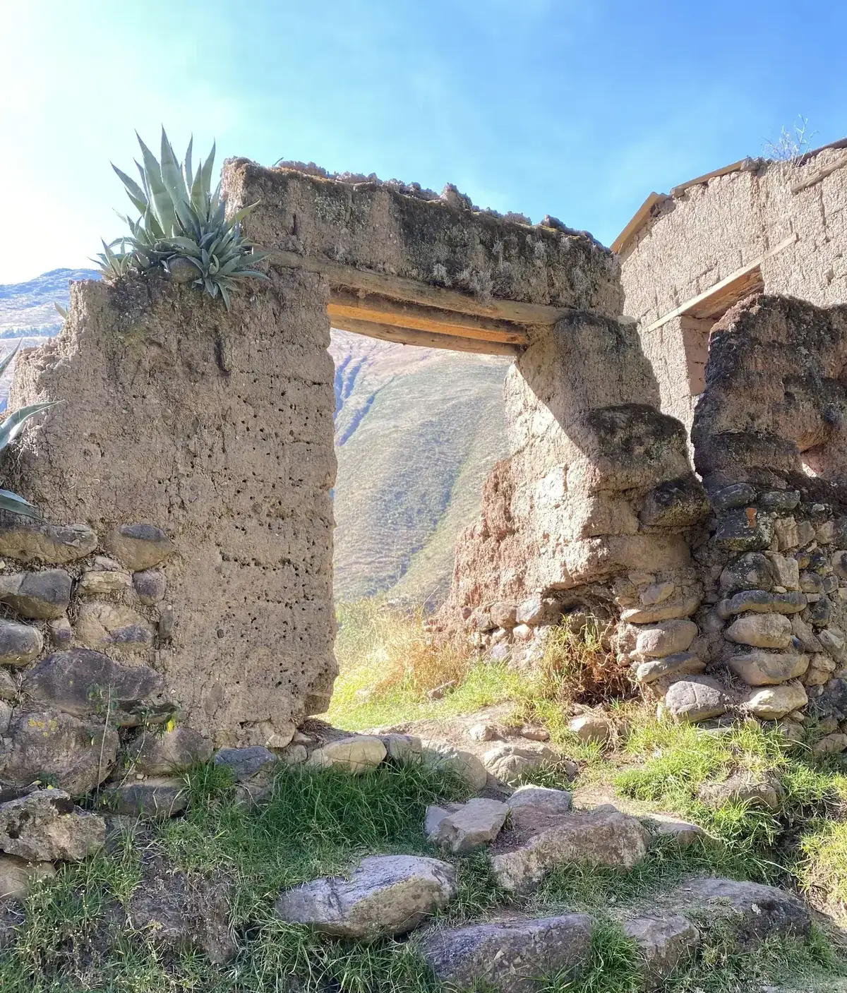 An ancient Incan stone doorway in the Sacred Valley, framing open sky